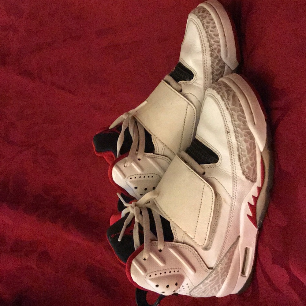 White and cement gray with red Jordan’s.